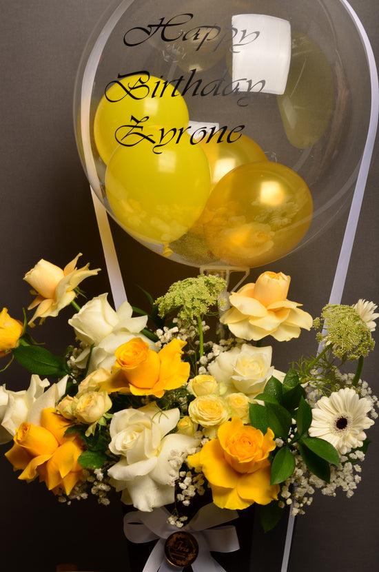 Yellow and white flowers box woth balloon