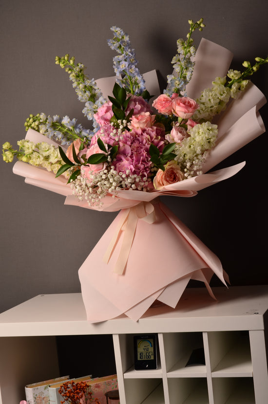 Pink and blue flowers bouquet