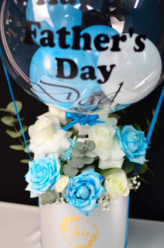 Blue flowers box with balloon