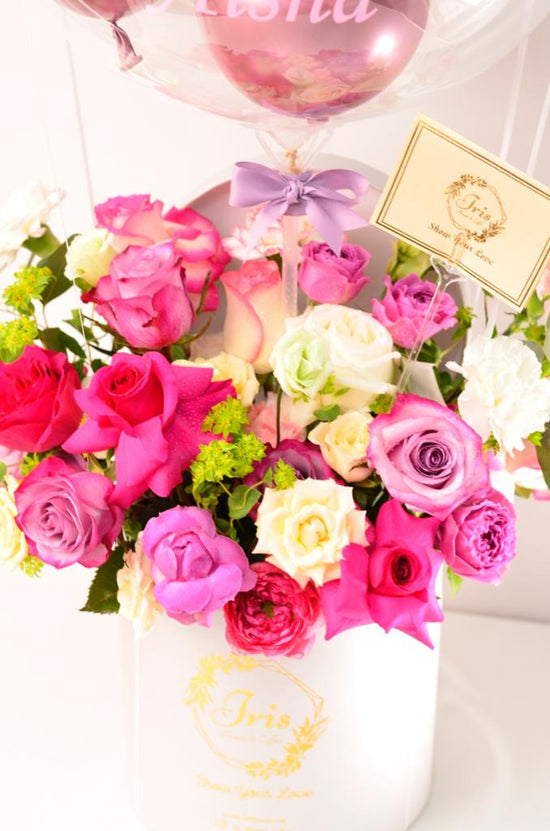 Pink flowers box with balloons