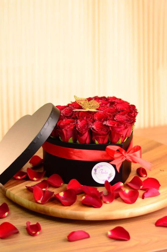 red rose in heart box