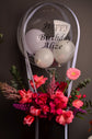 Pink flowers box with balloon
