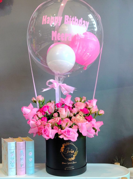 Pink flowers box with balloon