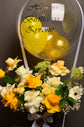 Yellow and white flowers box woth balloon