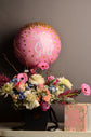 Pink and white flowers box with balloon