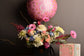 Pink and white flowers box with balloon