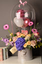 Blue and pink flowers box with balloon