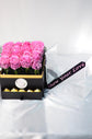 Pink flowers box with chocolate