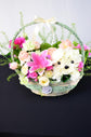 Pink and white flowers basket