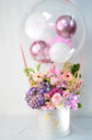 Pink and purple flowers box with balloon