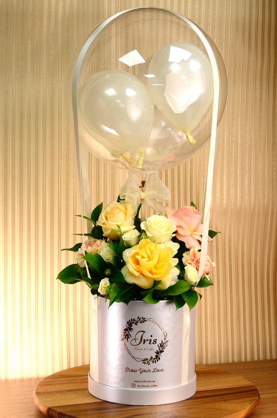 Yellow and Orange flowers with balloon in box