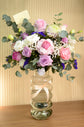 pink and white rose in a vase