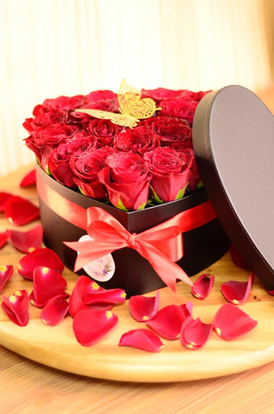 red rose in heart box