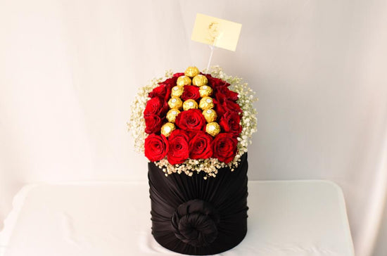 Red rose with chocolate box