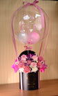 Pink flowers with balloon in box