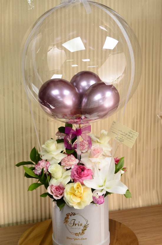 Pink and white rose with balloons in box