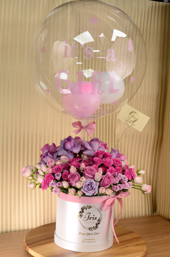 Luxury pink rose in box with balloon