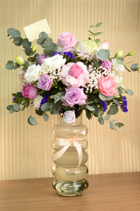 pink and white rose in a vase