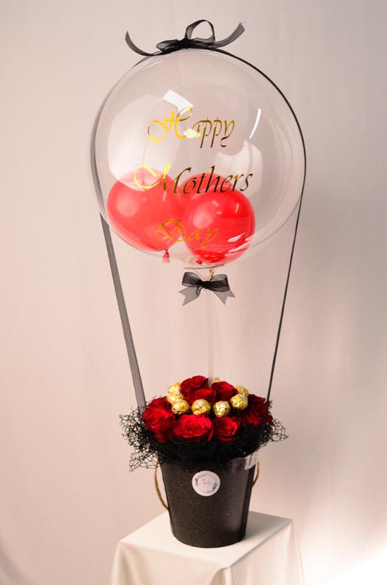 Red rose with ferrero in box
