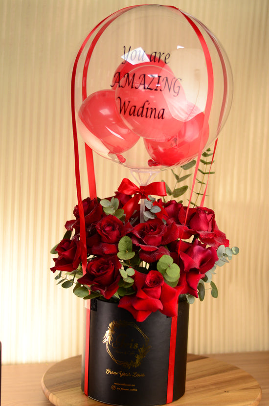red rose, balloons in box